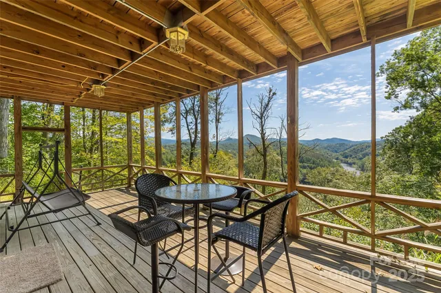 a view of a swimming pool with outdoor seating