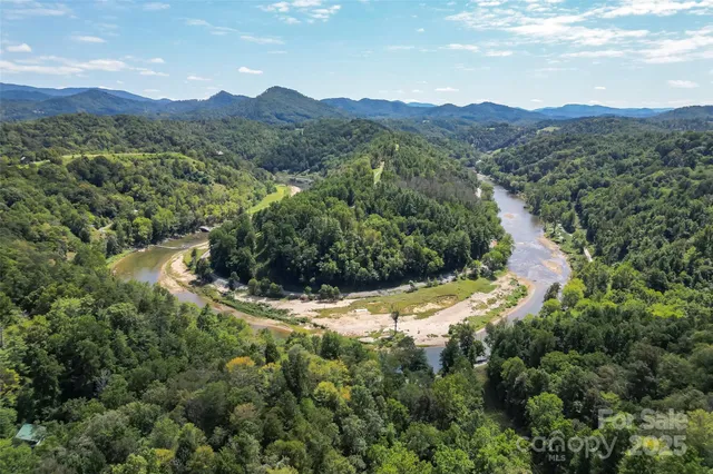 aerial view of a house with a yard