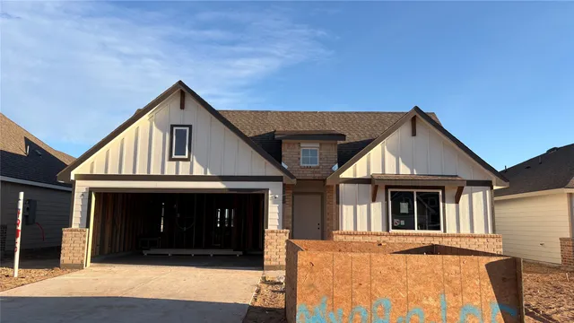 a front view of a house with a garage