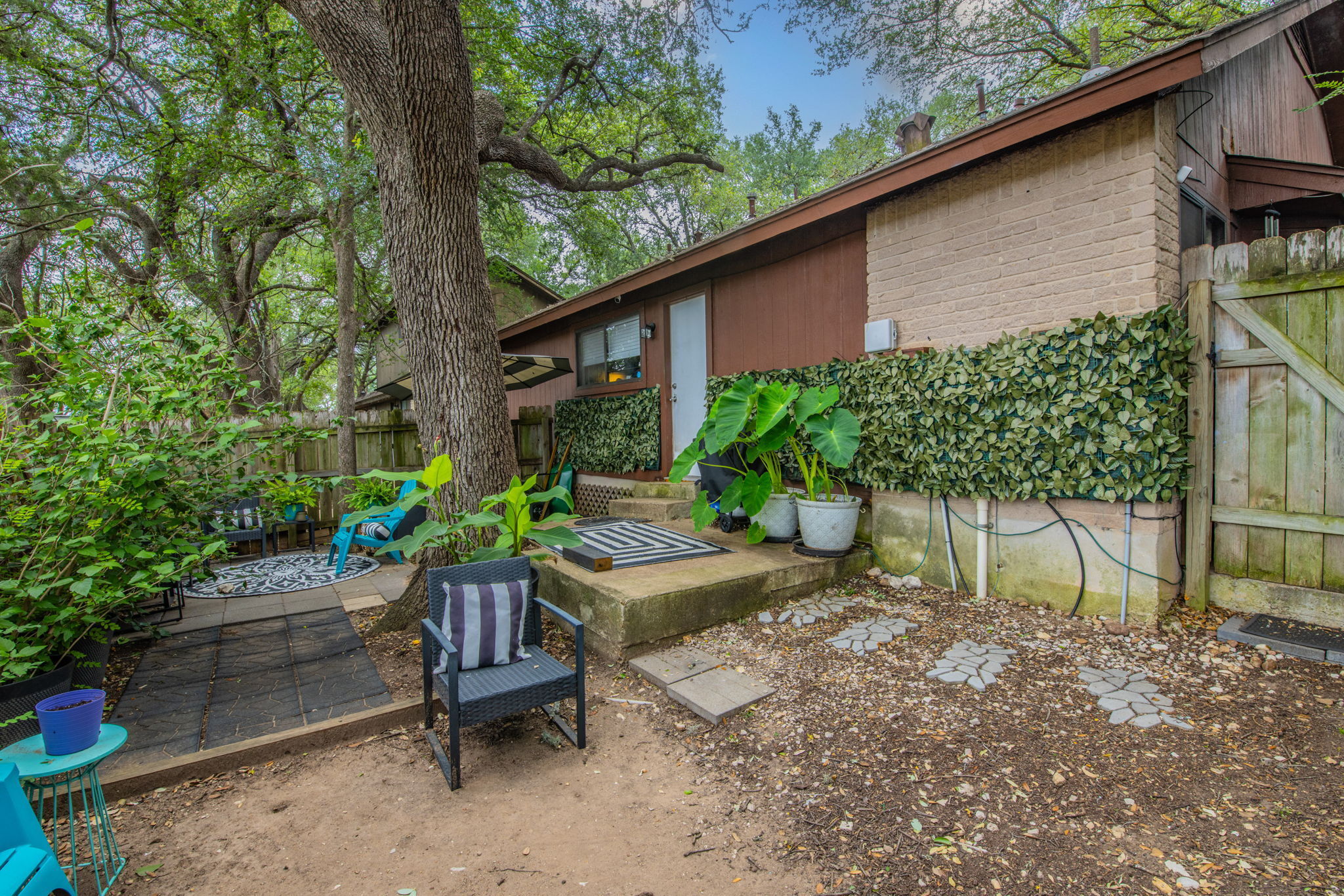 1008 Milford Way Austin, TX 78745 - Photo 18 of 40 Mature trees provide extensive natural shade to the exterior