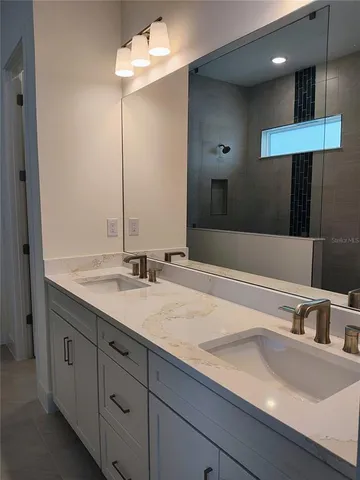a bathroom with a sink and a mirror