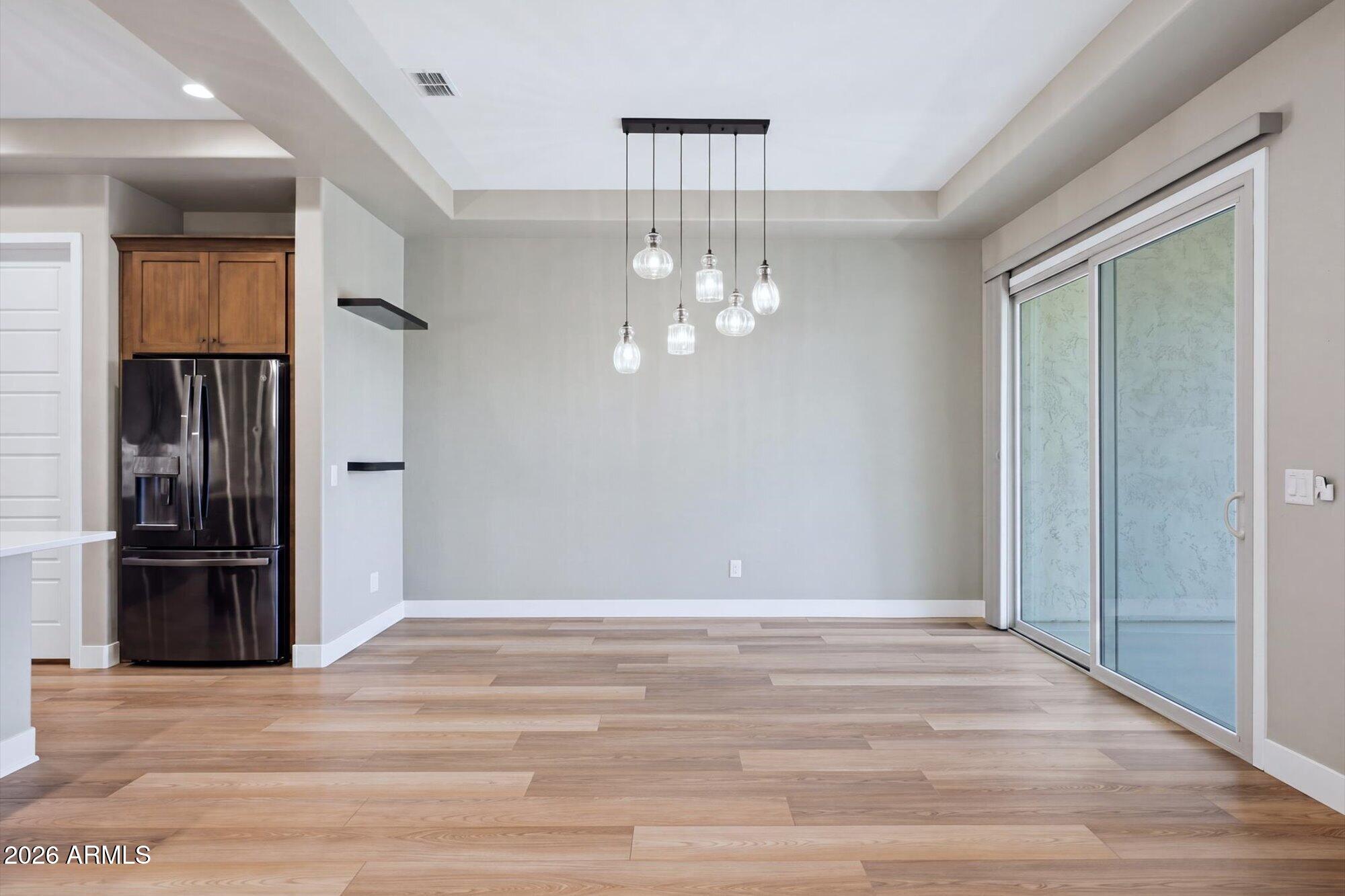 16849 West Merrell Street Goodyear, AZ 85395 - Photo 13 of 35 a view of a livingroom with wooden floor