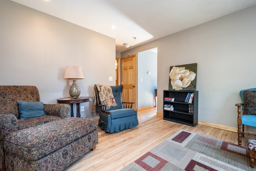 56 Ayer Road Shirley, MA 01464 - Photo 12 of 41 a living room with furniture and a fireplace