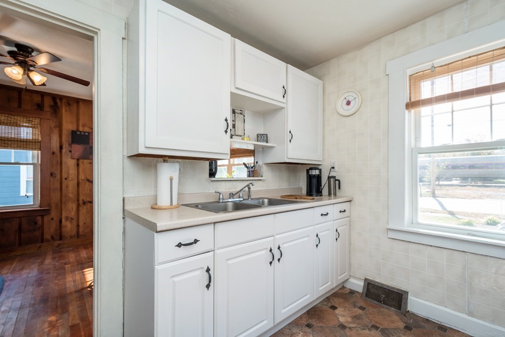 56 Ayer Road Shirley, MA 01464 - Photo 20 of 41 a kitchen with a sink cabinets and window