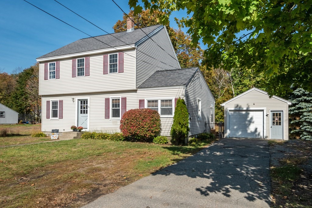 56 Ayer Road Shirley, MA 01464 - Photo 2 of 41 a front view of a house with a yard