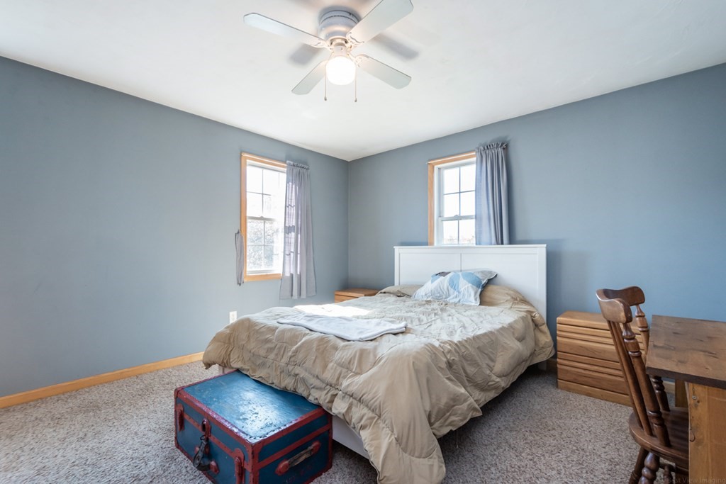 56 Ayer Road Shirley, MA 01464 - Photo 25 of 41 a bedroom with a bed desk and a window