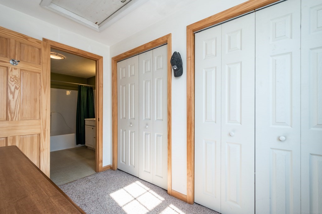 56 Ayer Road Shirley, MA 01464 - Photo 29 of 41 a view of a hallway with wooden floor and entryway