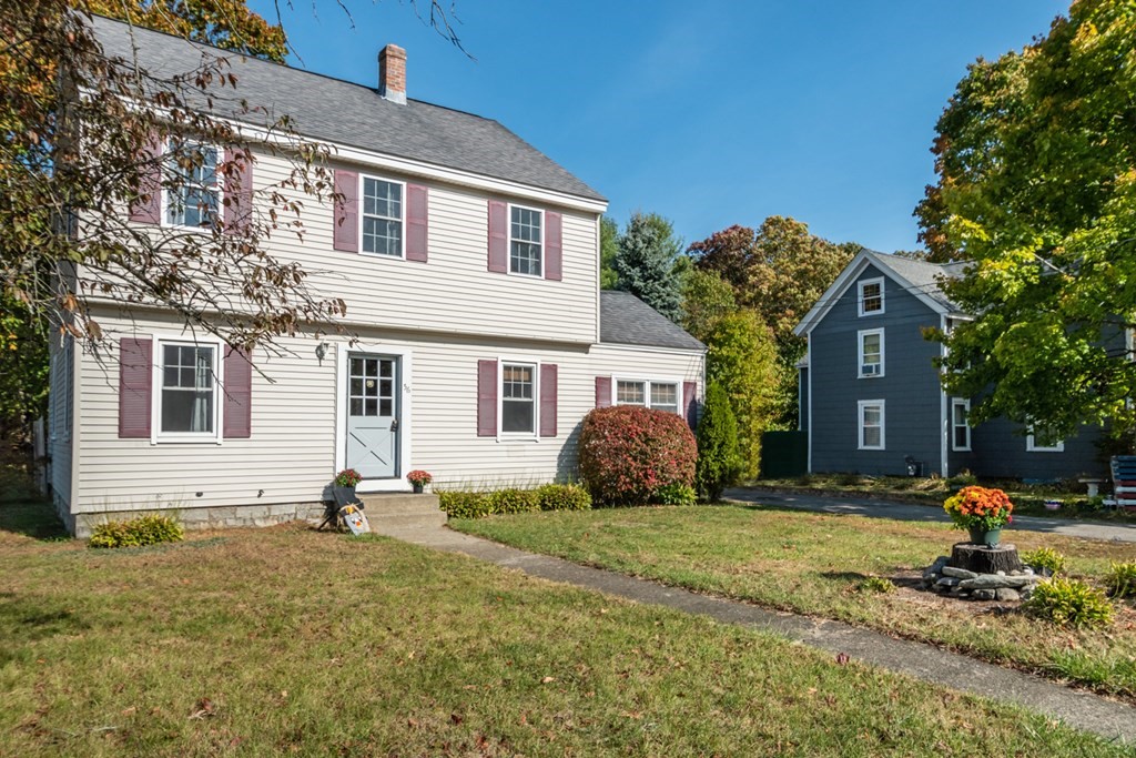 56 Ayer Road Shirley, MA 01464 - Photo 3 of 41 a front view of a house with a yard