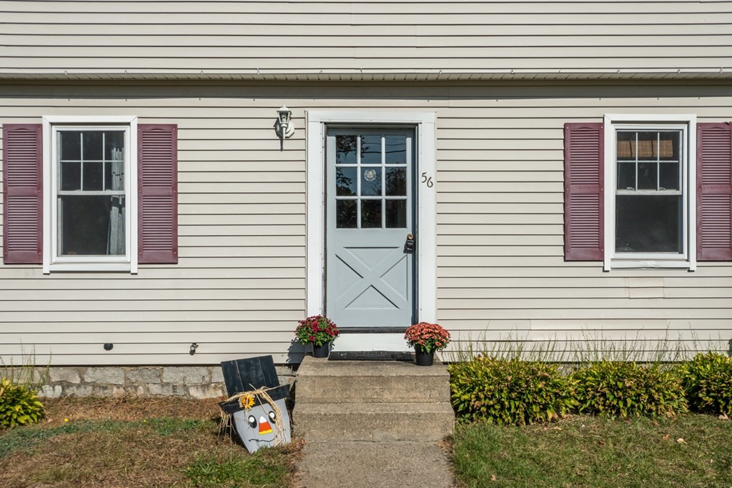 56 Ayer Road Shirley, MA 01464 - Photo 4 of 41 a view of a house with a small yard and plants