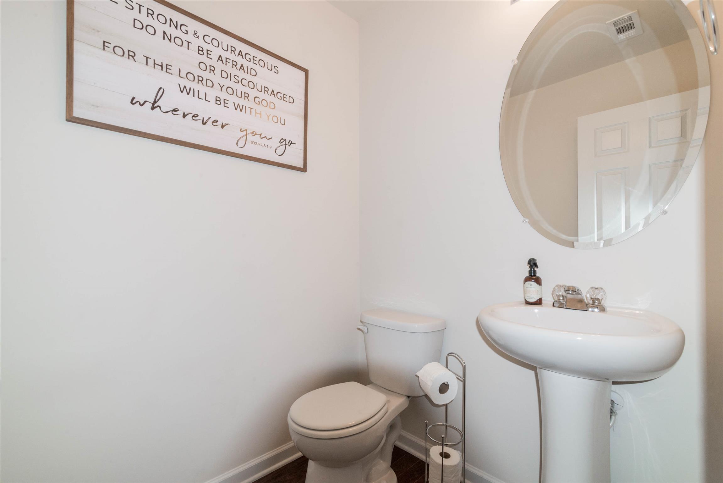 1448 Old Stone Road Lebanon, TN 37087 - Photo 14 of 25 a bathroom with a sink mirror and toilet