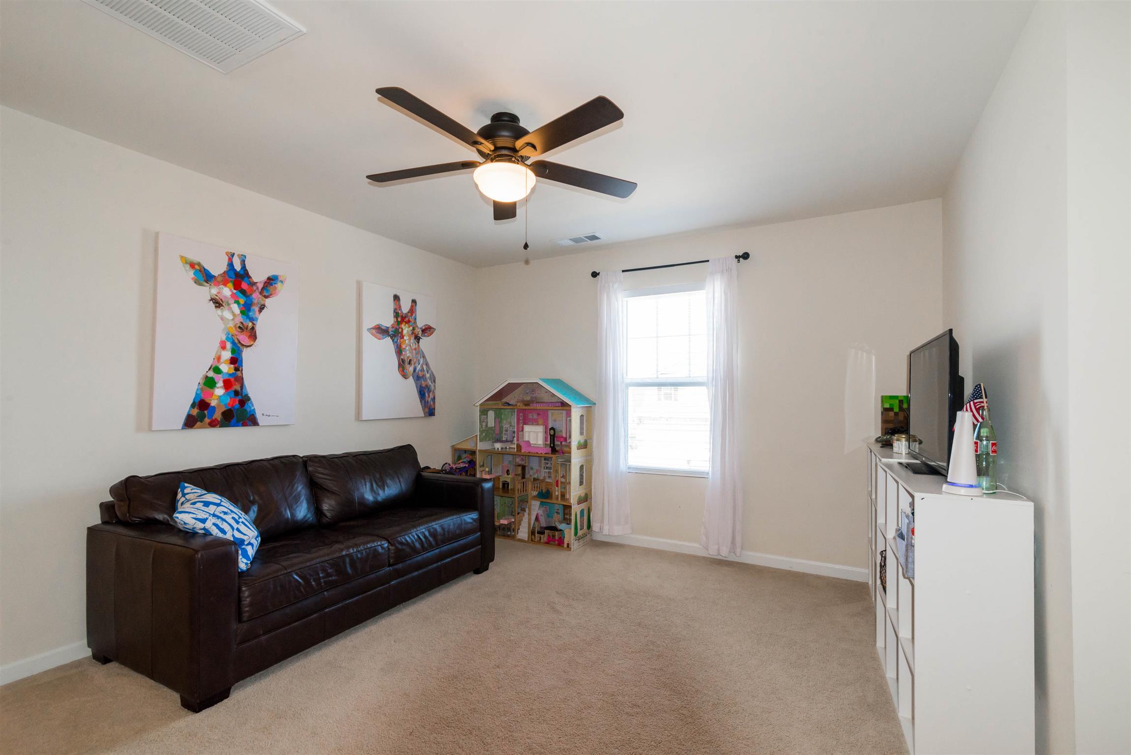 1448 Old Stone Road Lebanon, TN 37087 - Photo 15 of 25 a living room with furniture and a window