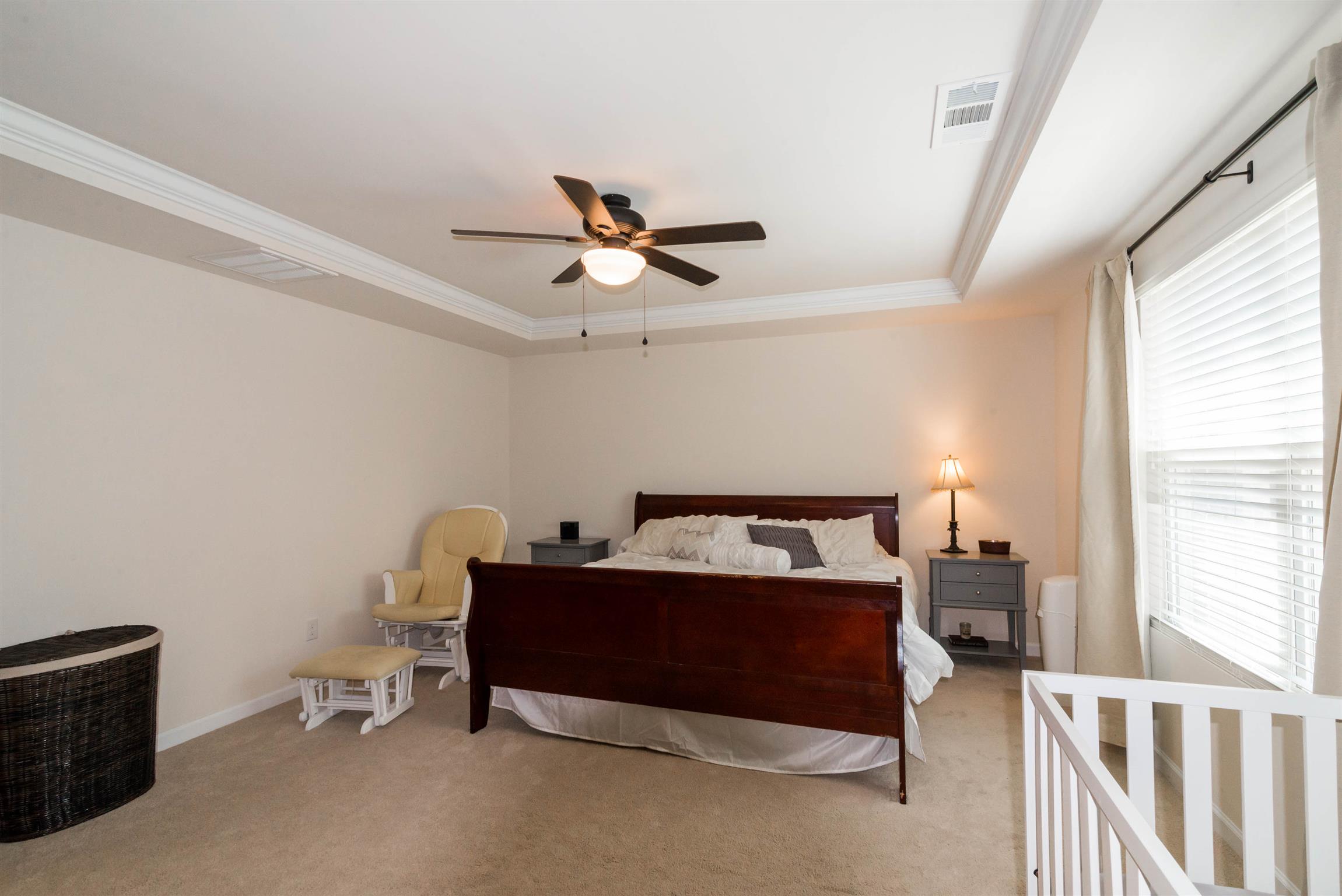 1448 Old Stone Road Lebanon, TN 37087 - Photo 16 of 25 a bed room with a bed and a ceiling fan