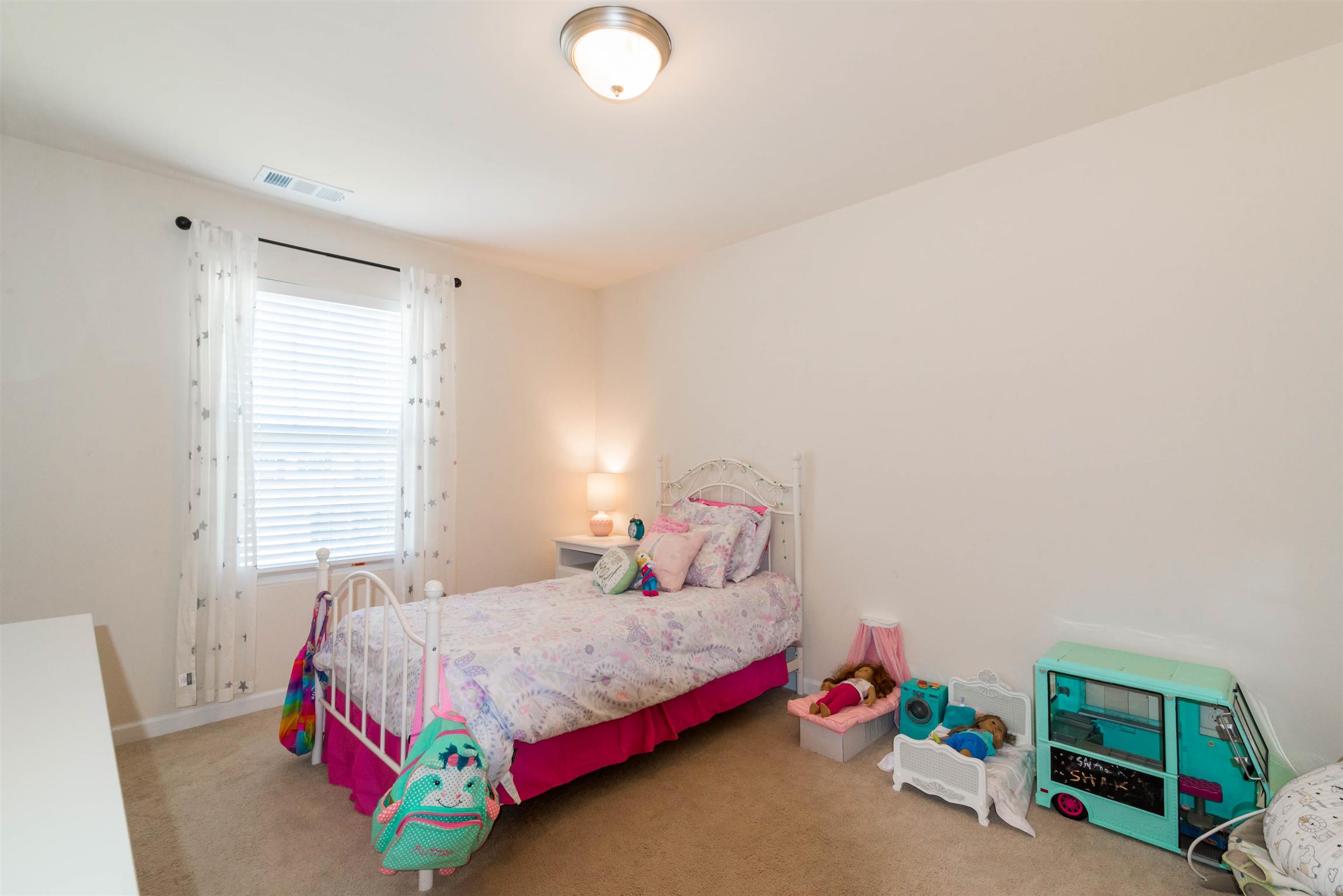 1448 Old Stone Road Lebanon, TN 37087 - Photo 19 of 25 a bedroom with a bed and a window
