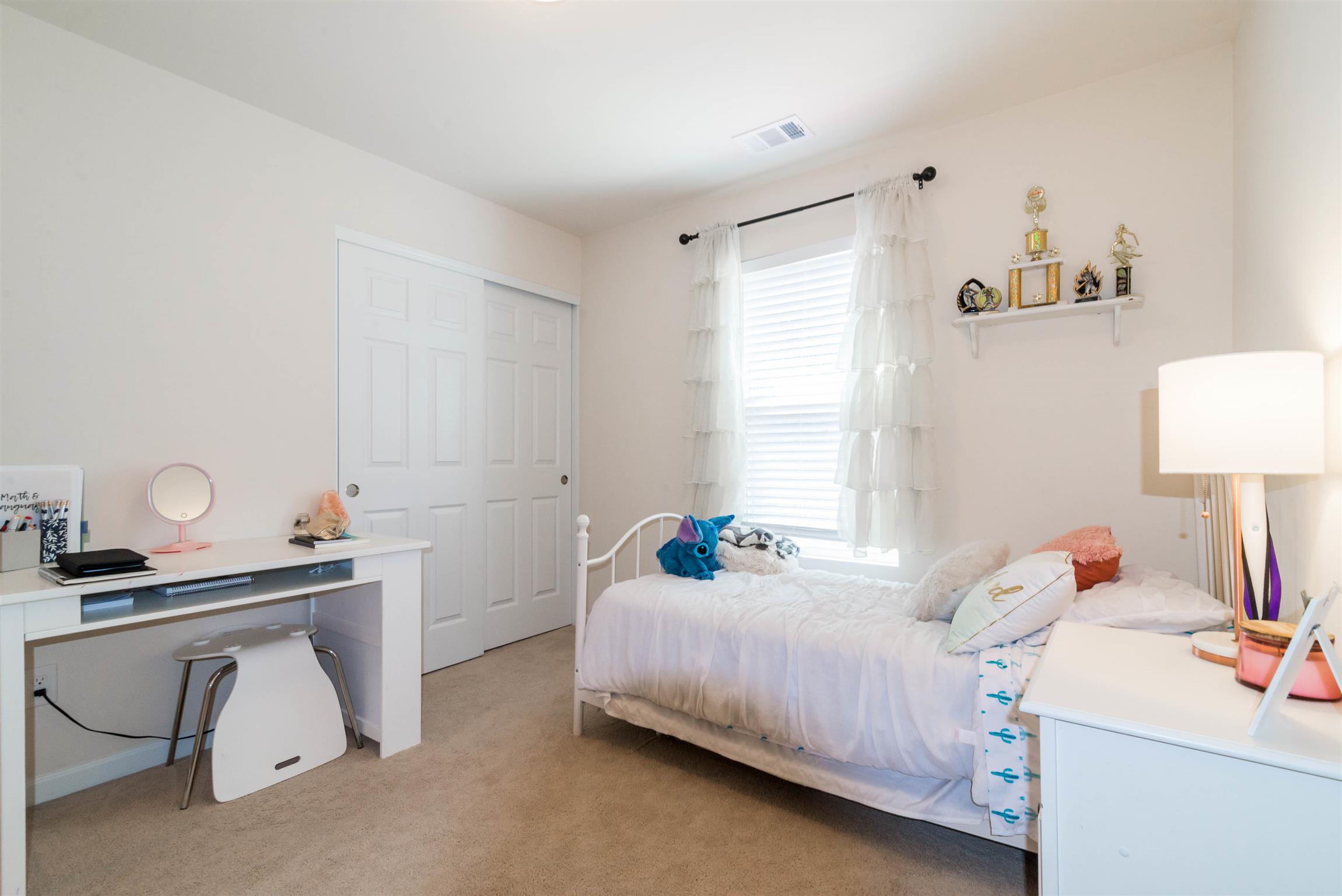 1448 Old Stone Road Lebanon, TN 37087 - Photo 21 of 25 a bedroom with a bed and a lamp on table