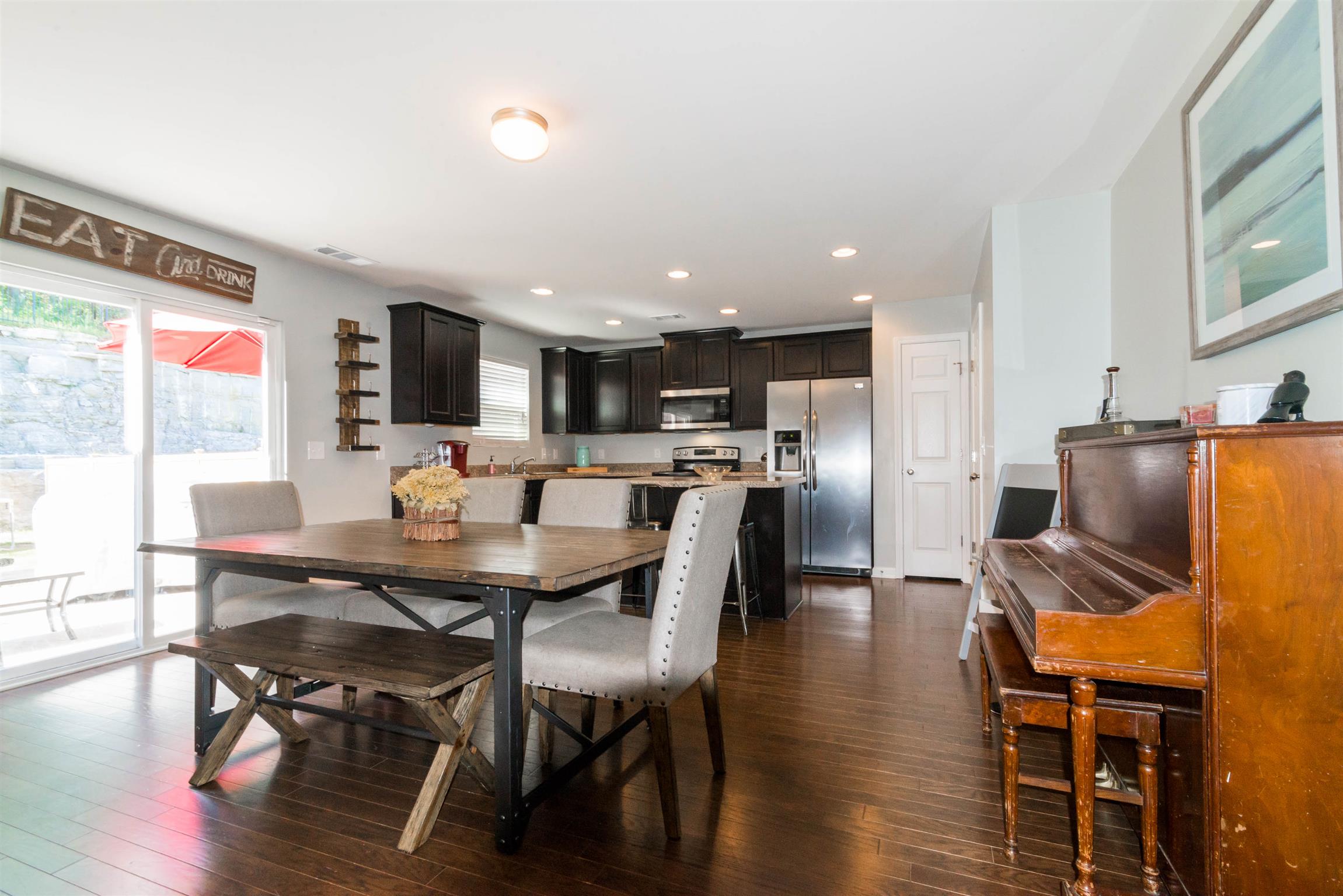 1448 Old Stone Road Lebanon, TN 37087 - Photo 8 of 25 a view of a dining room with furniture and wooden floor