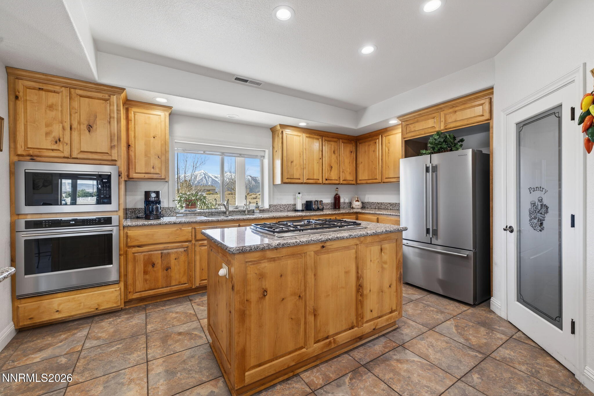1720 North Benton Road Minden, NV 89423 - Photo 13 of 46 a kitchen with stainless steel appliances granite countertop a refrigerator stove and oven