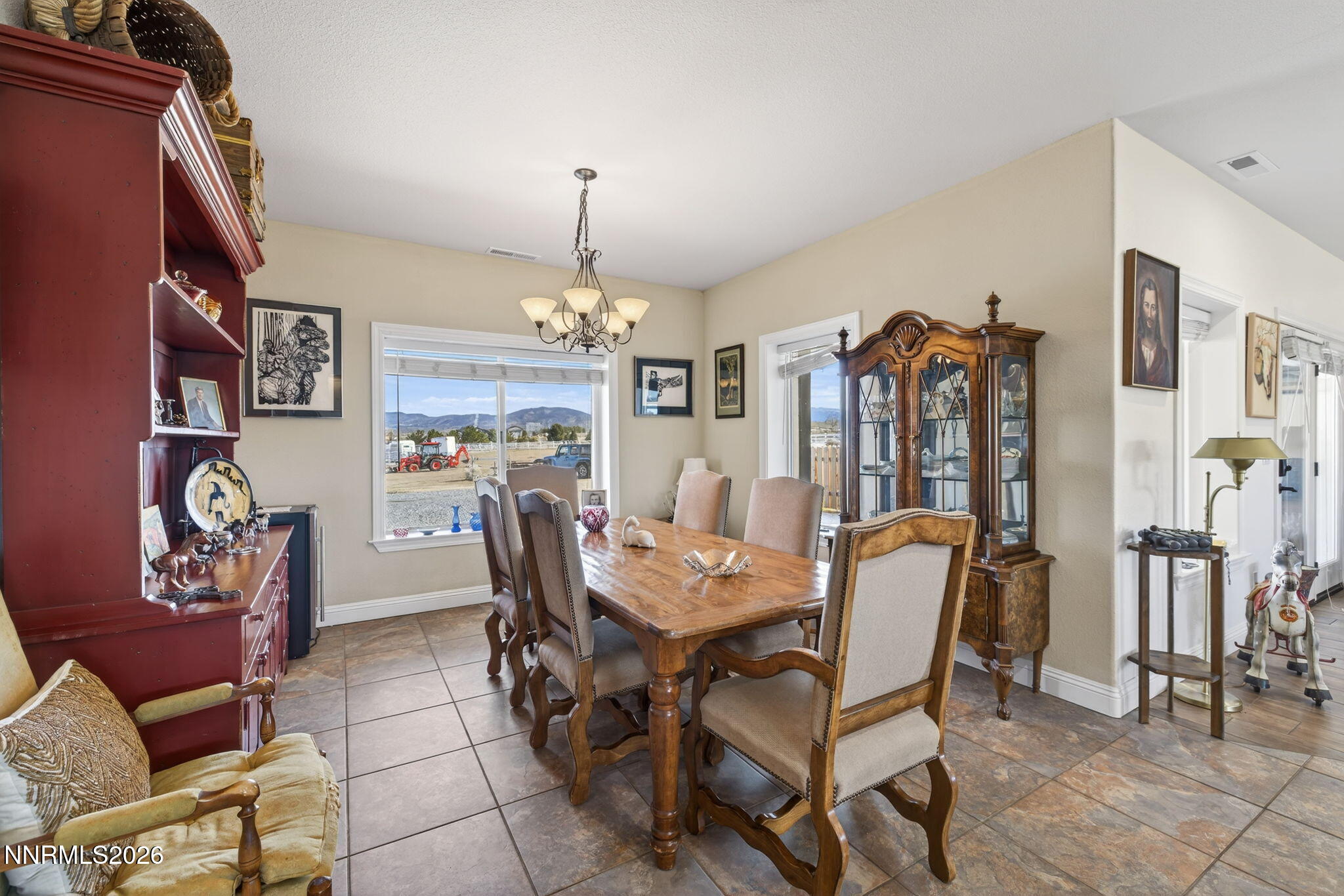 1720 North Benton Road Minden, NV 89423 - Photo 15 of 46 a view of a dining room with furniture and chandelier