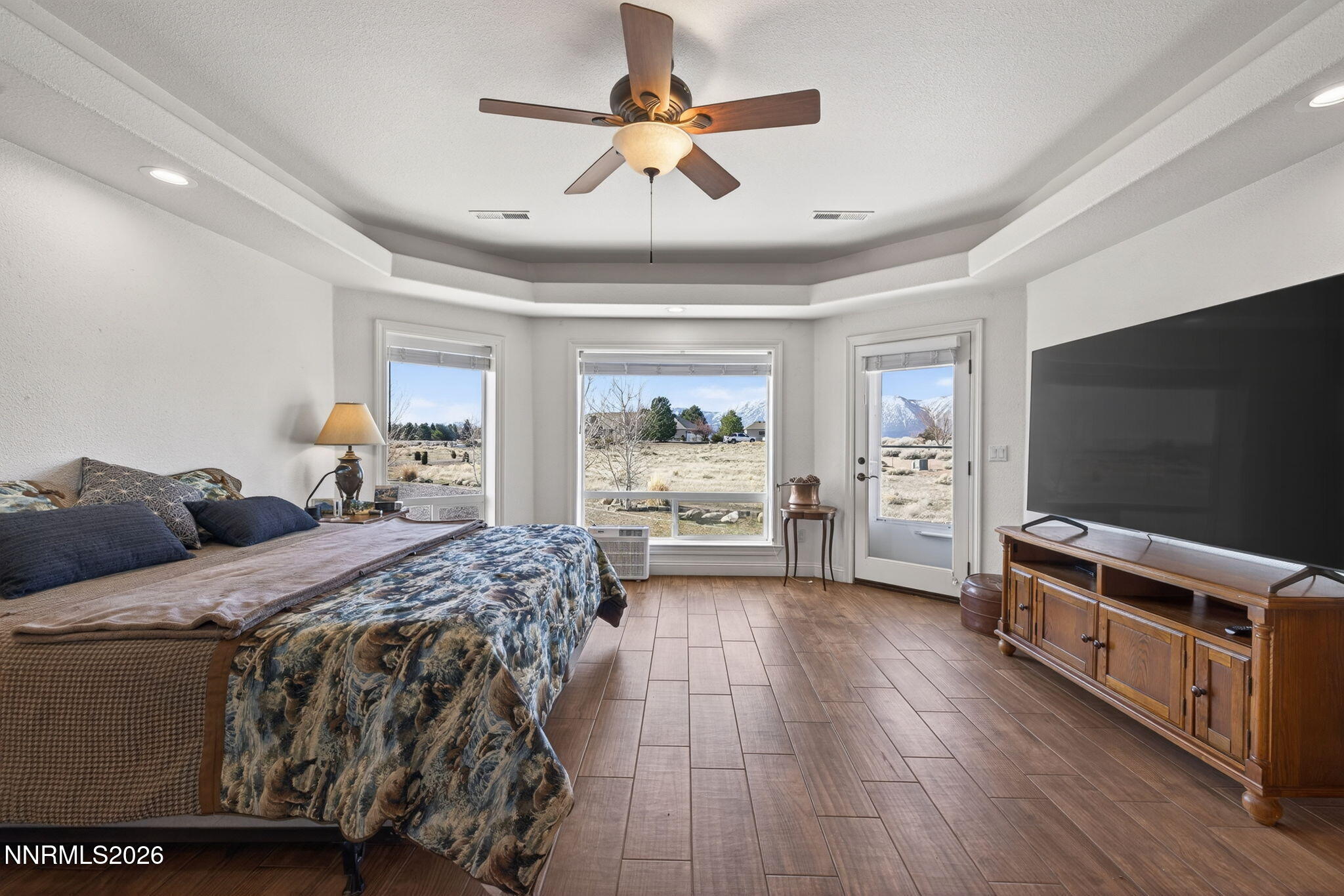 1720 North Benton Road Minden, NV 89423 - Photo 18 of 46 a bedroom with furniture and a flat screen tv