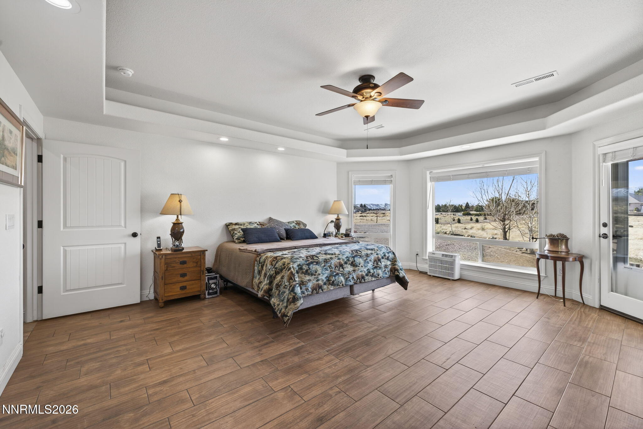 1720 North Benton Road Minden, NV 89423 - Photo 19 of 46 a bedroom with a bed and a large window