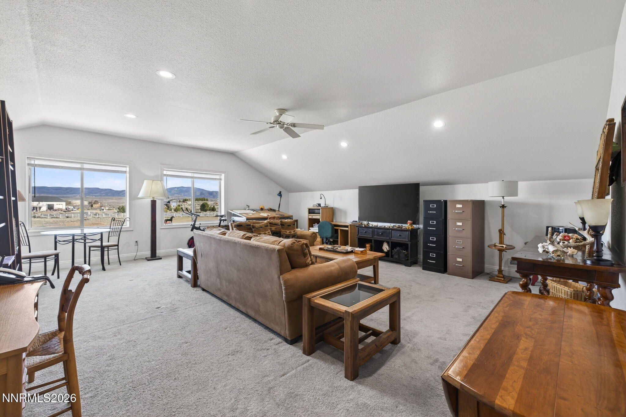 1720 North Benton Road Minden, NV 89423 - Photo 26 of 46 a living room with furniture and a flat screen tv