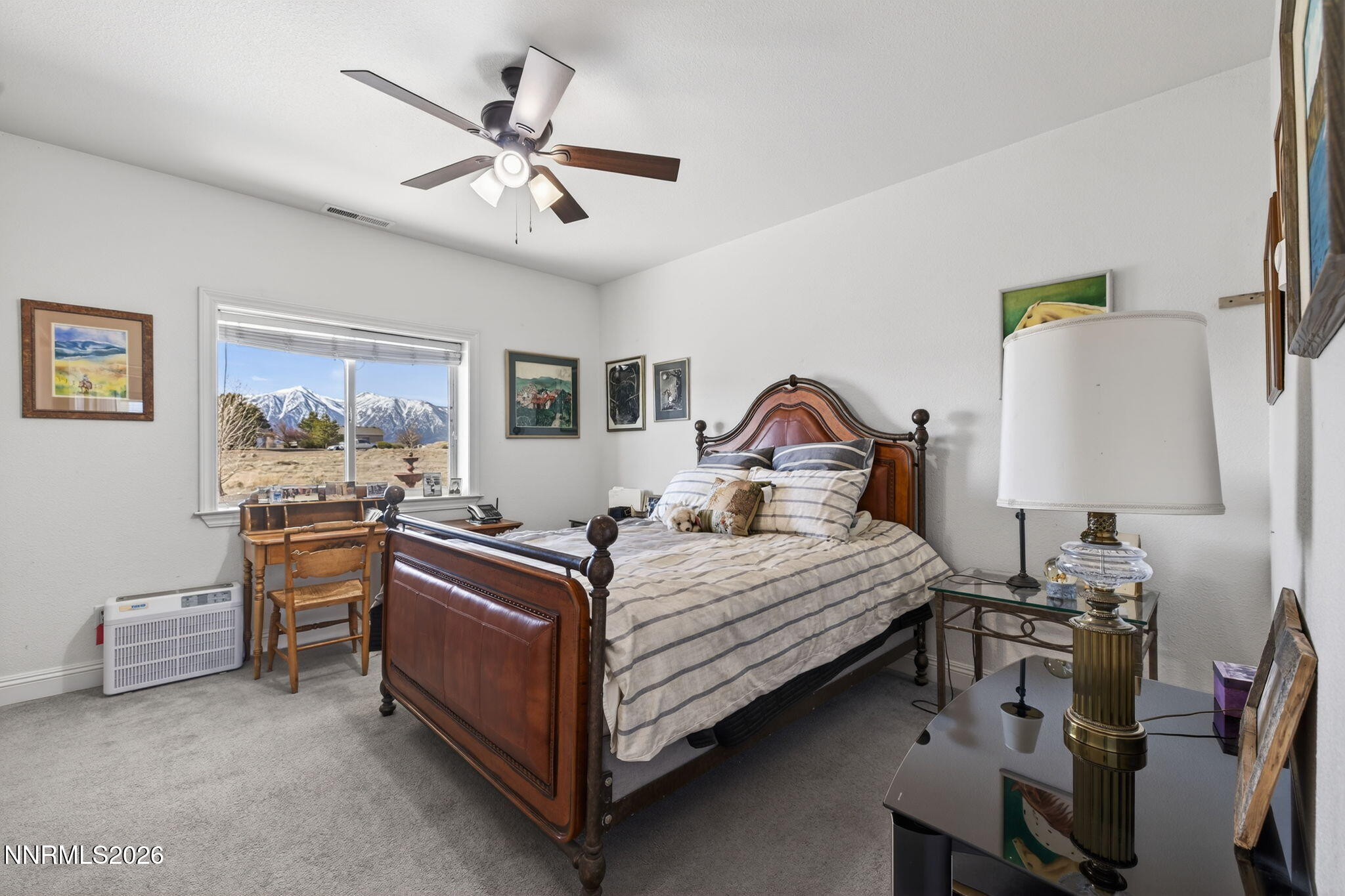 1720 North Benton Road Minden, NV 89423 - Photo 29 of 46 a bedroom with a bed and a chandelier