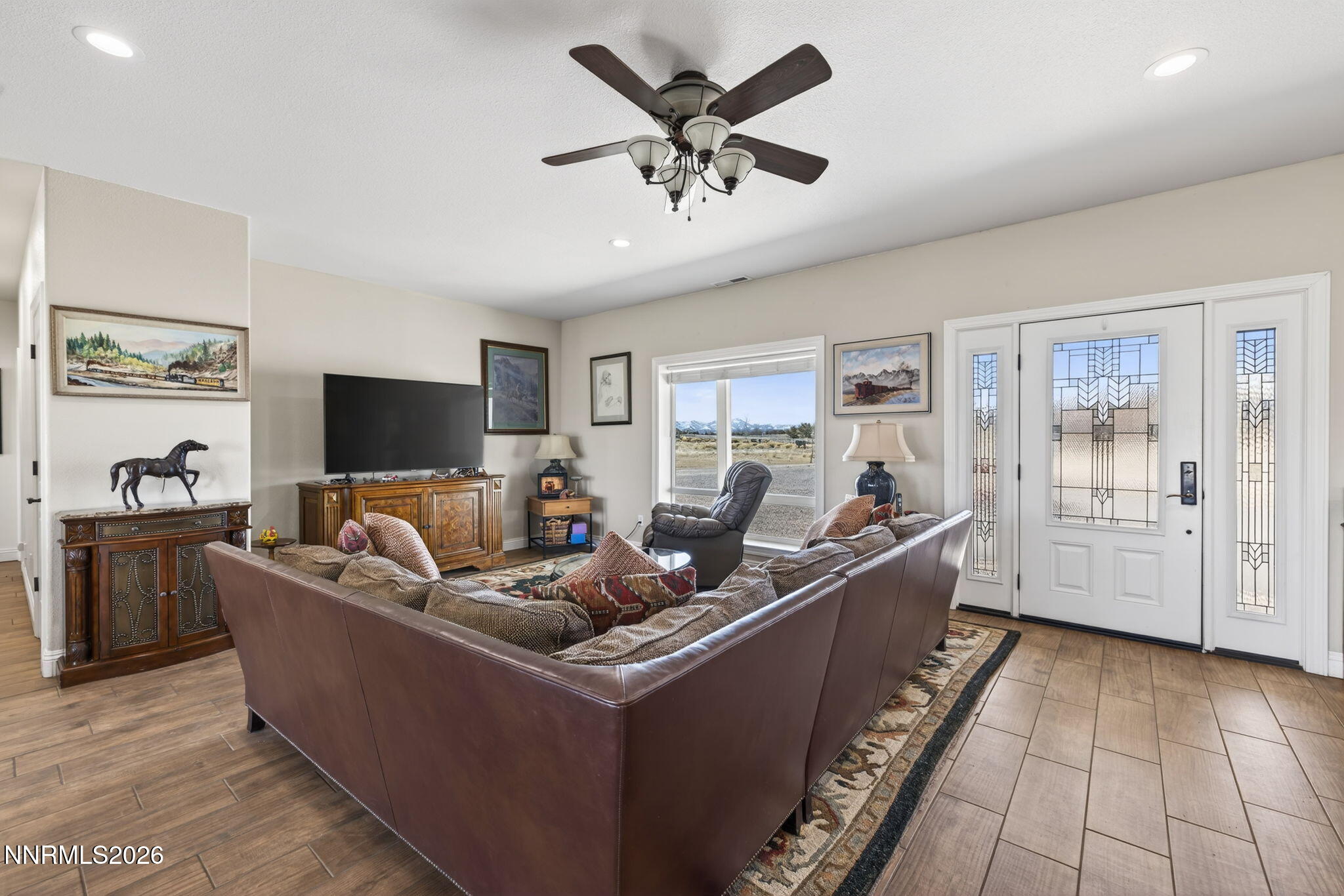 1720 North Benton Road Minden, NV 89423 - Photo 9 of 46 a living room with furniture and a flat screen tv