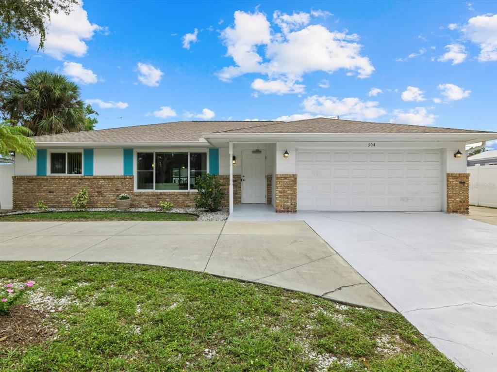 504 Center Road Venice, FL 34285 - Photo 1 of 1 Front elevation with circle driveway