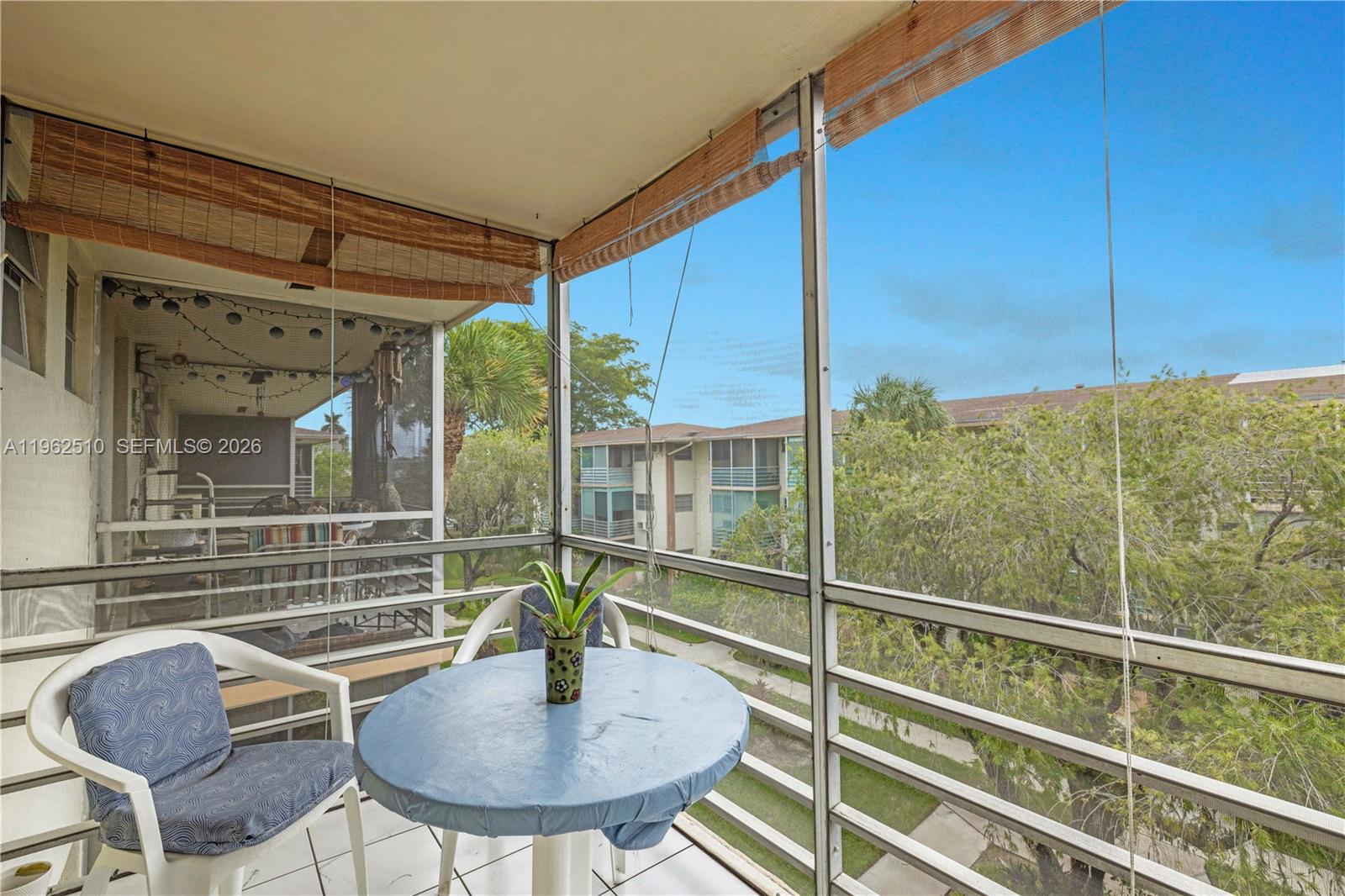 16750 Northeast 14th Avenue, Unit 308 Miami, FL 33162 - Photo 14 of 29 a view of a chairs and table in the balcony