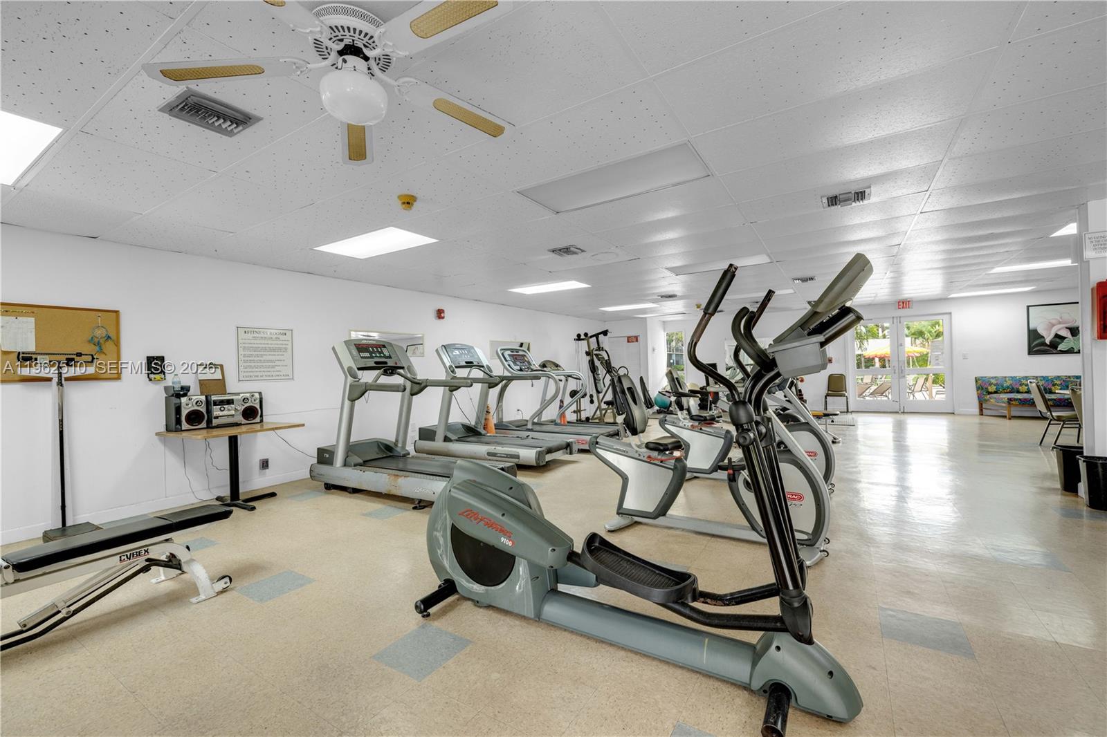 16750 Northeast 14th Avenue, Unit 308 Miami, FL 33162 - Photo 22 of 29 a view of a room with gym equipment
