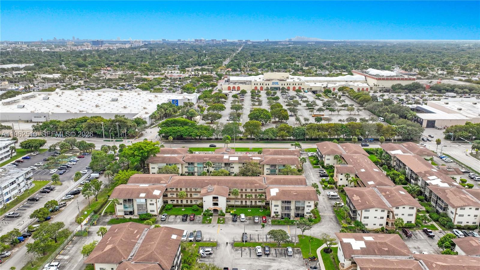 16750 Northeast 14th Avenue, Unit 308 Miami, FL 33162 - Photo 25 of 29 an aerial view of residential building and lake