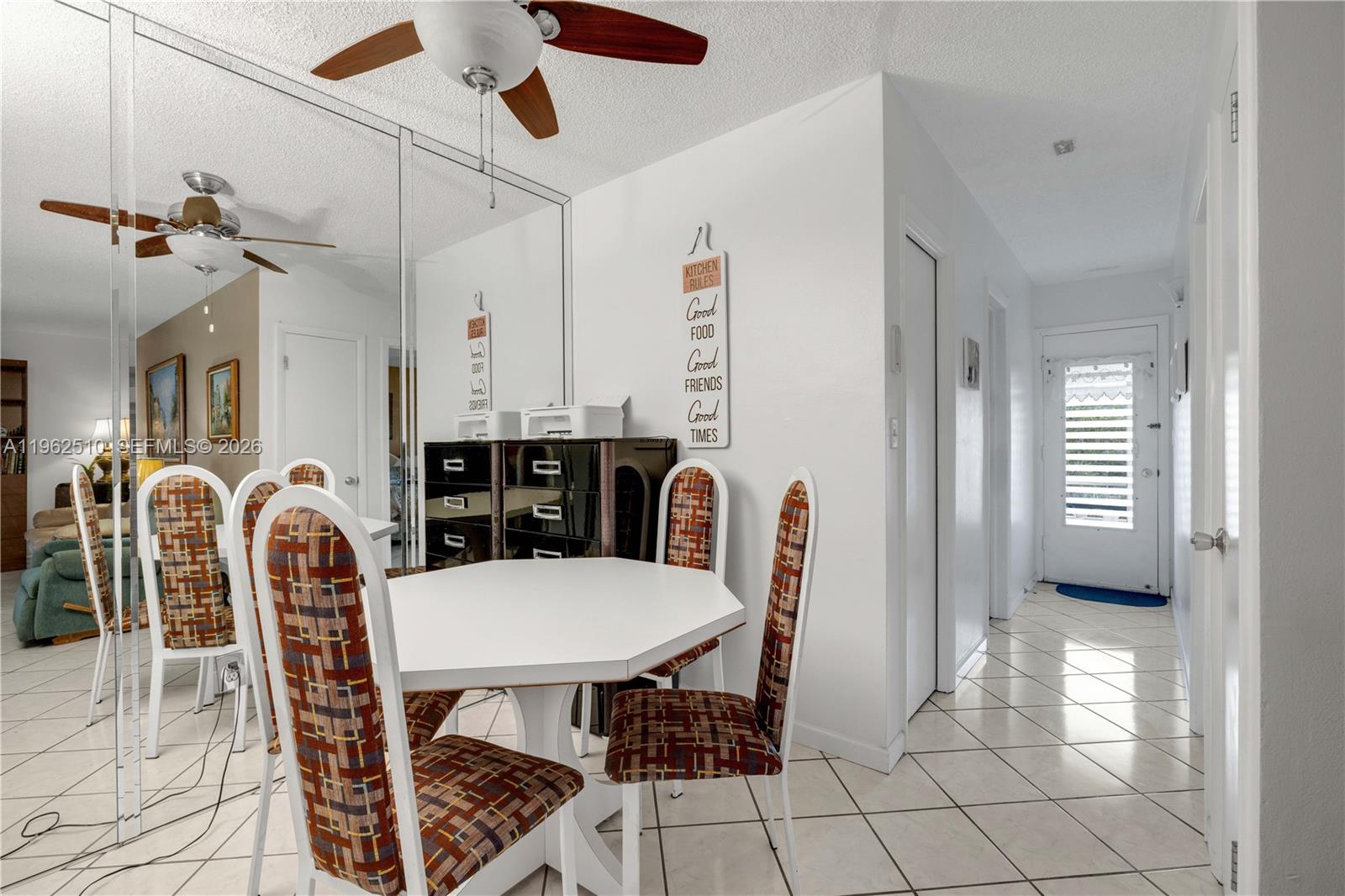 16750 Northeast 14th Avenue, Unit 308 Miami, FL 33162 - Photo 6 of 29 a view of a a dining room with furniture window and wooden floor