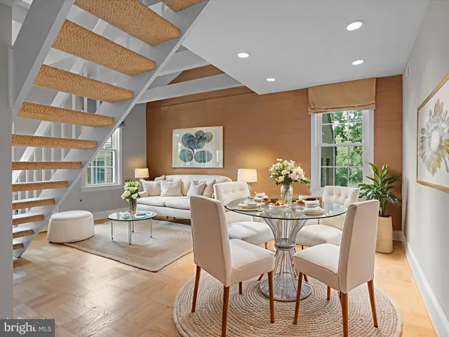a dining room with furniture and window