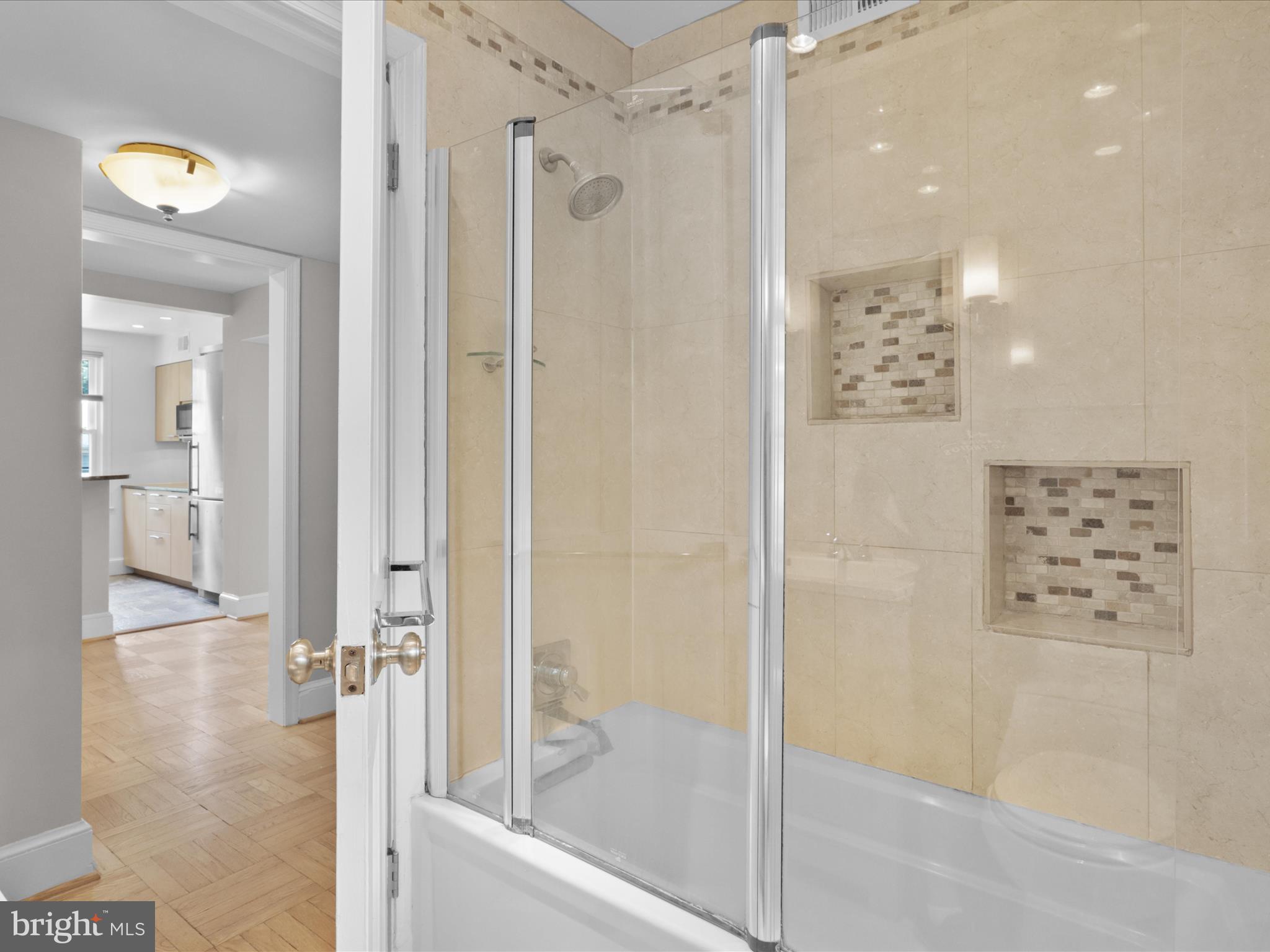 2721 Ordway Street Northwest, Unit 5 Washington, DC 20008 - Photo 13 of 39 a bathroom with a shower and a glass door