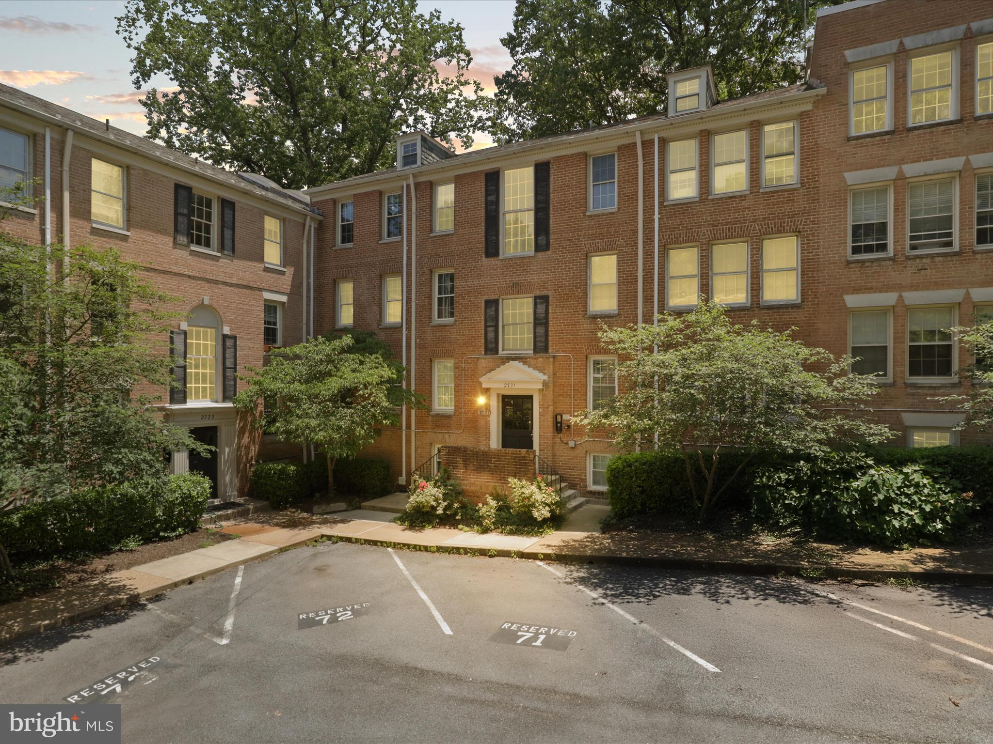 2721 Ordway Street Northwest, Unit 5 Washington, DC 20008 - Photo 2 of 39 a front view of a residential apartment building with a yard