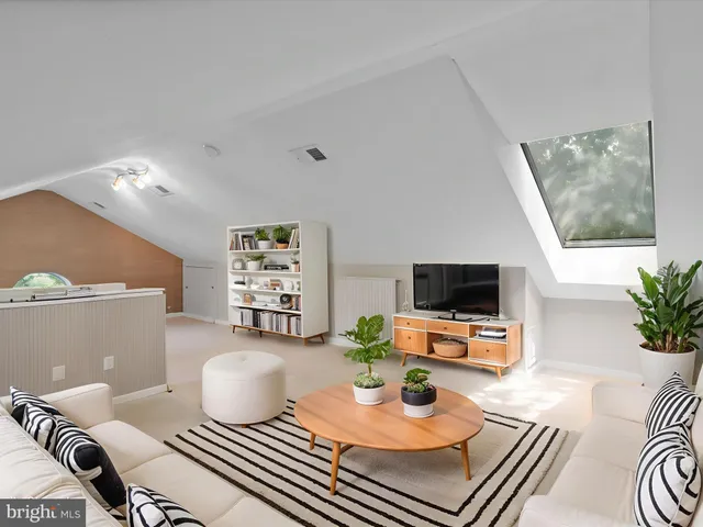 a bedroom with a bed and flat screen tv