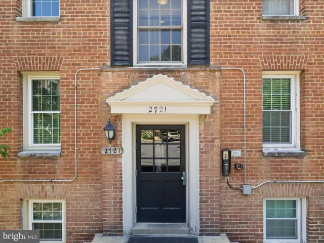 a front view of a building with a couple of windows