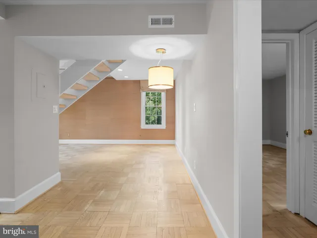 a view of a hallway with a window