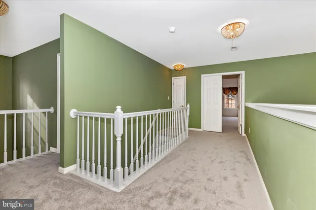 a bathroom with a bathtub sink and mirror