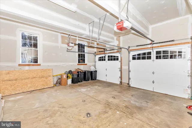 a view of a house with a yard covered with snow