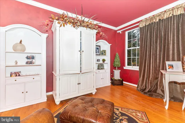 a view of a dining room with furniture and a chandelier