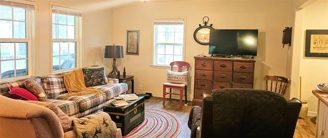 a swimming pool with lots of tress in the background