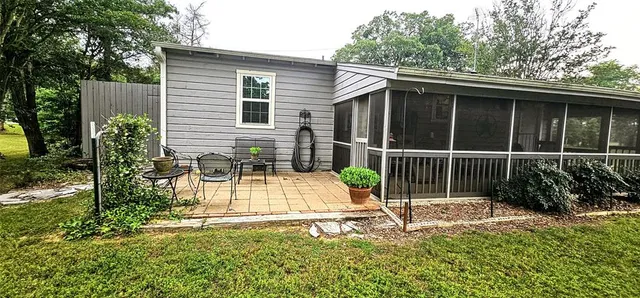 a view of a backyard with a small garden
