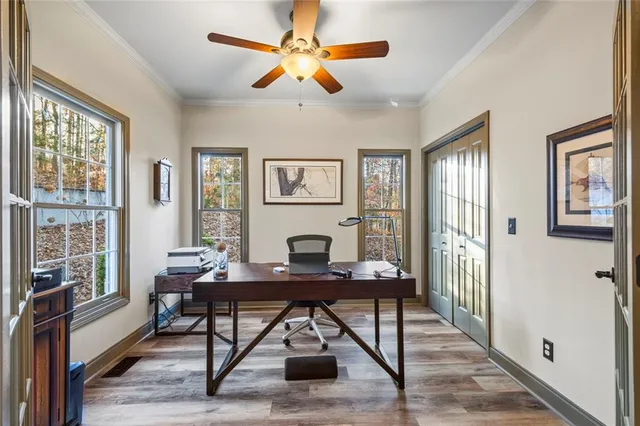 a view of living room filled with furniture and wooden floor