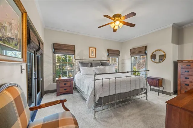 a kitchen with stainless steel appliances granite countertop a stove a sink and white cabinets