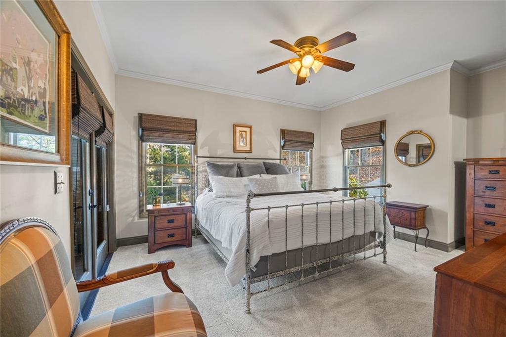 152 Chapman Manor Drive Martin, GA 30557 - Photo 17 of 90 a bedroom with a bed and a chandelier