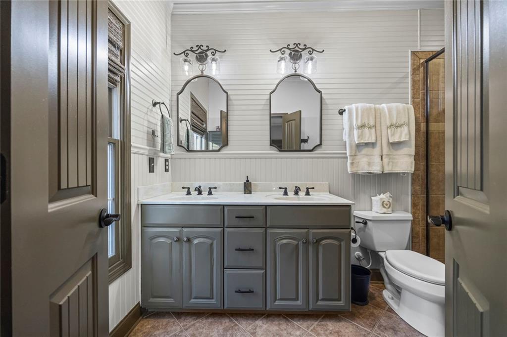 152 Chapman Manor Drive Martin, GA 30557 - Photo 19 of 90 a bathroom with a granite countertop toilet sink and mirror