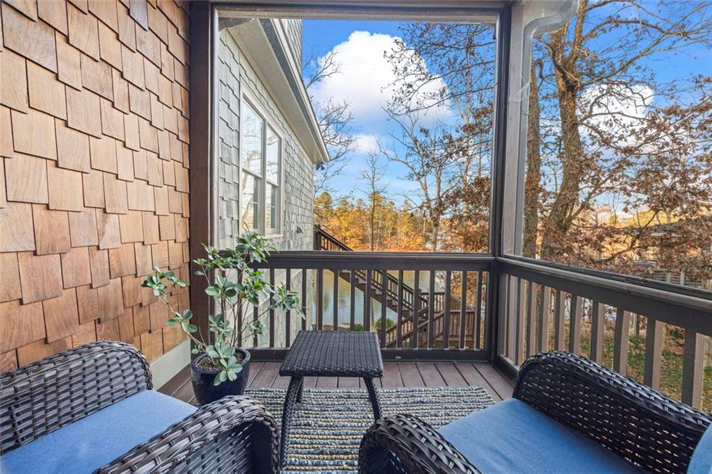 152 Chapman Manor Drive Martin, GA 30557 - Photo 21 of 90 a balcony view with a potted plant and wooden floor