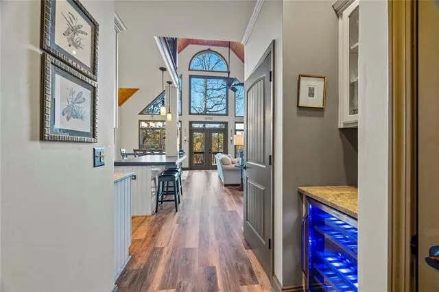 a living room with furniture a fireplace and a large window