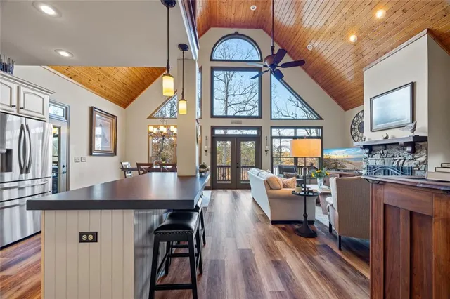 a living room with furniture and floor to ceiling windows
