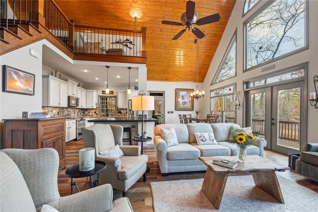 152 Chapman Manor Drive Martin, GA 30557 - Photo 44 of 90 a living room with furniture and a dining table with kitchen view